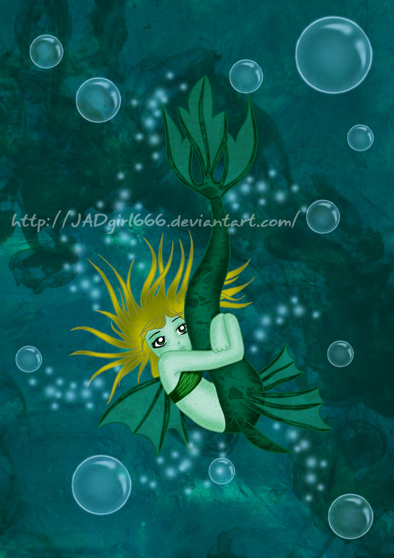 Young mermaid girl hugging tail while underwater surrounded by bubbles